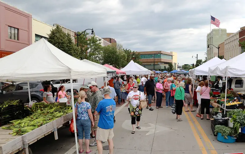 People shopping at a farmer's market.