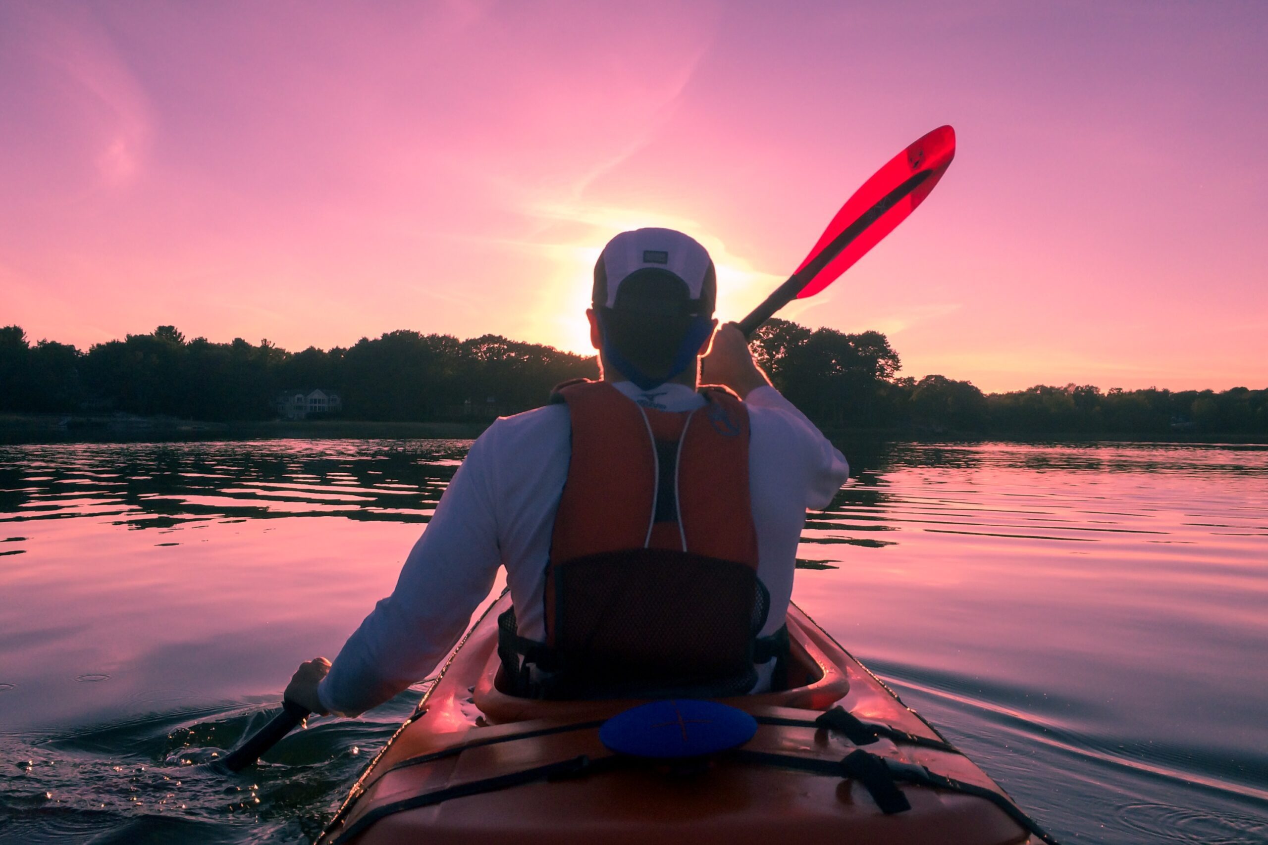 Man kayaking in a river with beautiful sky image, public domain CC0 photo.