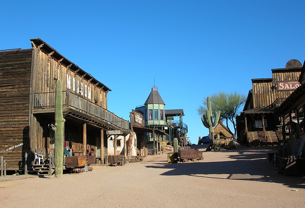 Street view of Goldfield Ghost Town with old buildings from the 1800s.